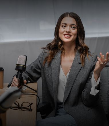 A woman speaking to the microphone