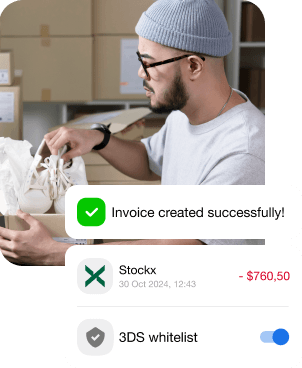 A photo with the man who bought the shoes, packs them up and issues a receipt for the product.