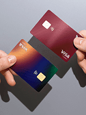Two hands with Visa cards